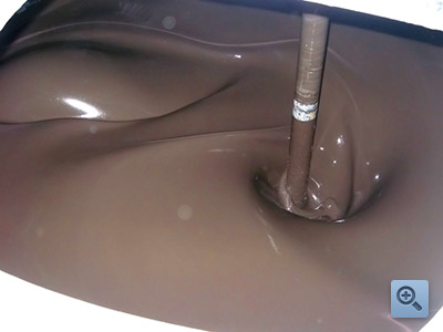 Brown paint being mixed